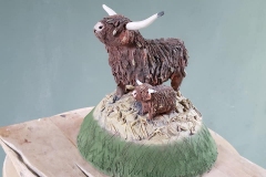 cow-and-calf-on-a-mound